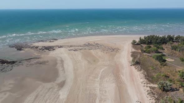 Aerial drone shot of White Sandy Beach, Blue Water and Rocks at Lee Point, Near Darwin, Northern Ter