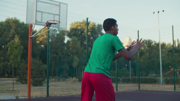 Basketball Player Shooting for Field Goals Outdoor