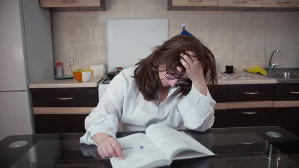 Nervous Woman Preparing for the Exam Reading Business Literature