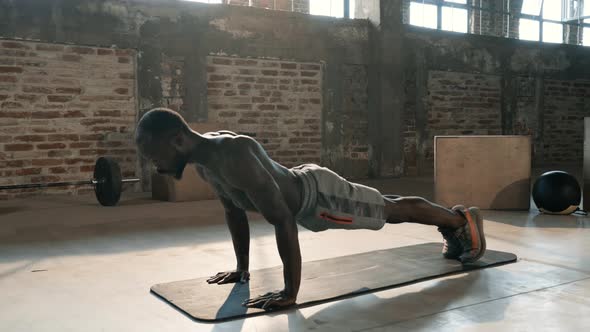 Exercise. Sport man working out in gym, doing push-up