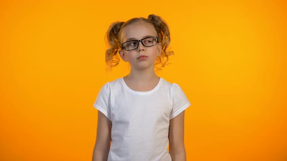 Beautiful Nerd Girl Raising Finger Up Having Brilliant Idea, Education Program