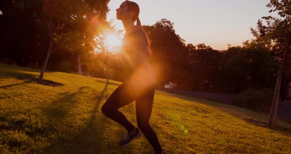 Athletic Woman Running Up A Hill Slow-Motion