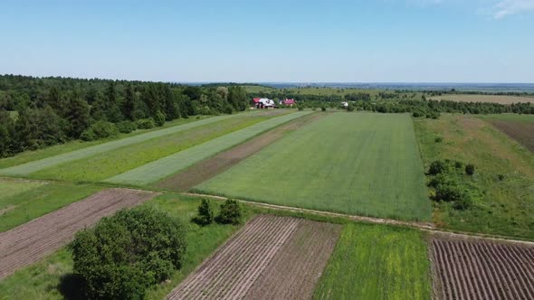 Aerial drone view of a flying over the rural agricultural landscape.