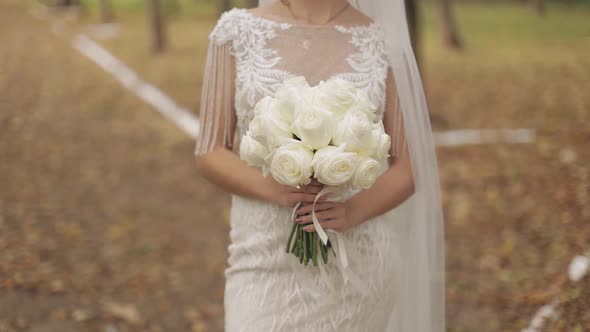 Wedding Bouquet in the Hands of the Bride. Wedding Day. Engagement