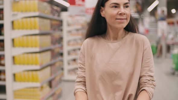 Woman Doing Shopping In Hypermarket