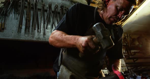 Blacksmith working on a iron rod