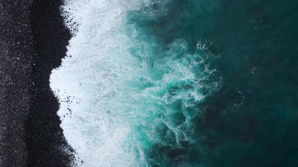 Top View of a Deserted Black Volcanic Beach. Coast of the Island of Tenerife. Aerial Drone Footage