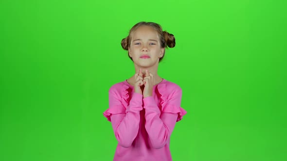 Child Crosses His Fingers, She Hopes To Win, Green Screen, Slow Motion