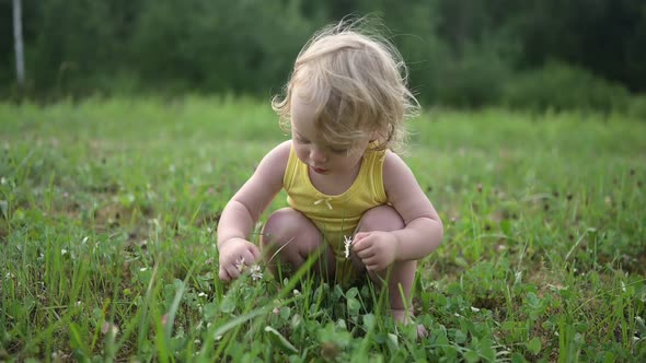 Little Funny Cute Blonde Girl Child Toddler in Yellow Bodysuit Crying Afraid of Learning to Swim