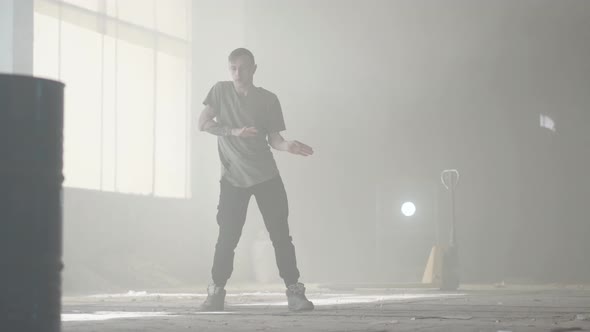 Great Young Hip-hop Dancer Performing in the Fog