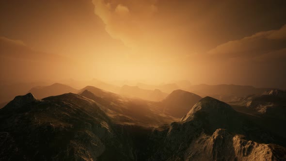 High Mountain Peaks Covered with Dramatic Heavy Fog alt