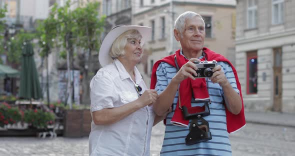 Senior Male and Female Tourists Makes a Photo While Traveling in Lviv, Ukraine