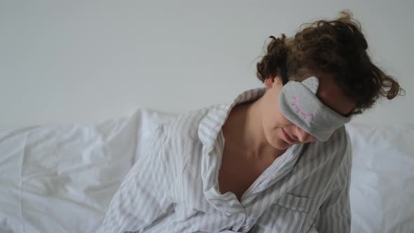 Tired Sleepy Woman in Face Sleep Mask Waking Up Exhausted Stressed and Sad Without Energy Taking