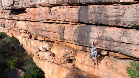 Male rock climber climbing mountain 4k