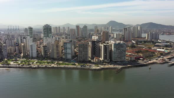 Panning wide landscape of coast city of Santos state of Sao Paulo Brazil.