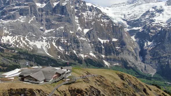 Drone shot of the First mountain over Grindelwald town, Switzerland