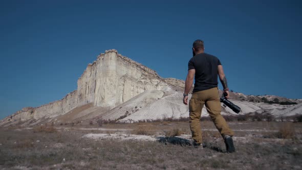 Photographer traveler photographs a huge white rock