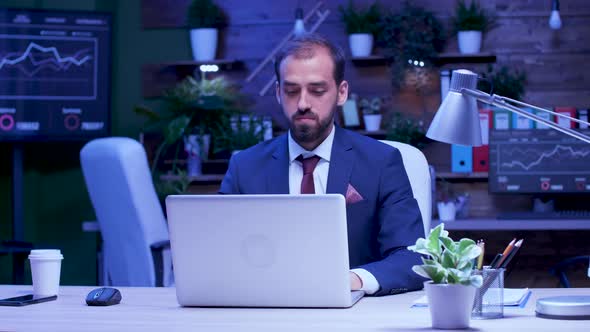 Businessman Working Late at Night in the Office