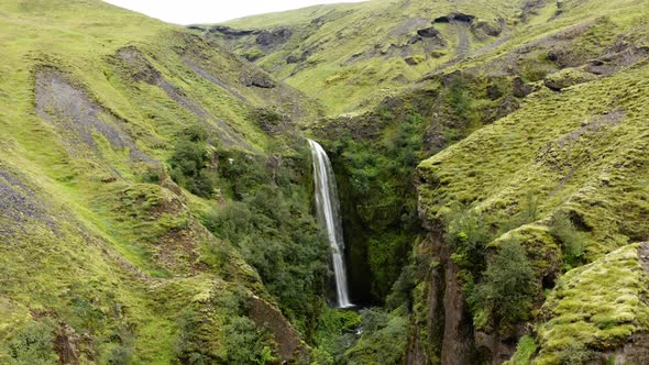 Narrow Ravine with a Waterfall in the middle of it