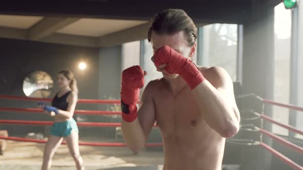 Male Boxer Standing in the Boxing Ring