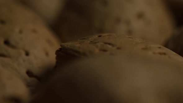 Cinematic, rotating shot of almonds on a white surface - ALMONDS 