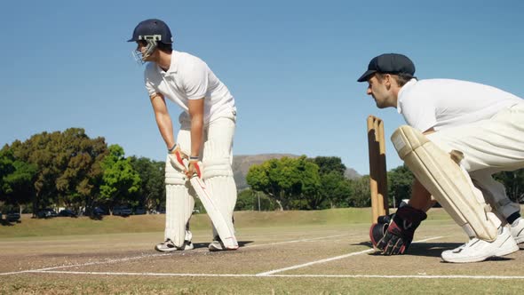 Batsman hitting a ball during cricket match