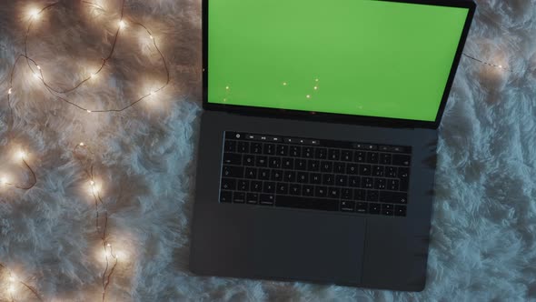 Laptop With Green Screen In The Night