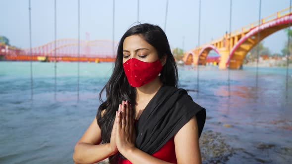 Indian Woman Meditating Wearing Coronavirus Protection Face Mask Sitting in Sadhana or Spiritual