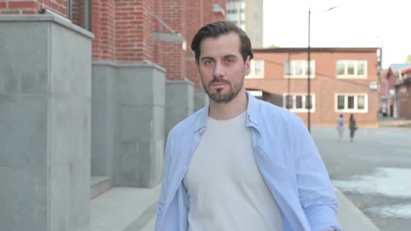 Portrait Shot of Man Walking in Street