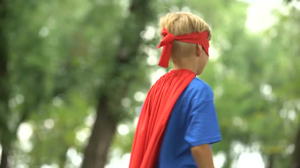 Superhero Boy Showing Muscles, Game as Psychotherapy for Child Confidence