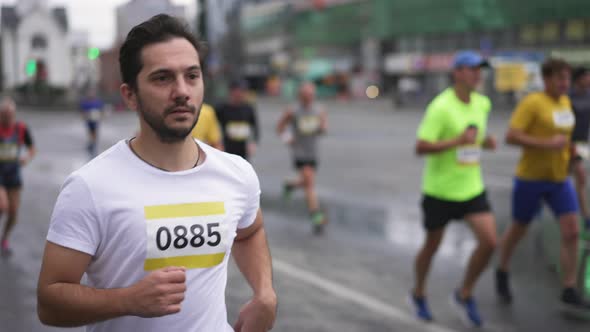 Major Running Competition with Crowds Groups of Athletic Runners and Sportsmen