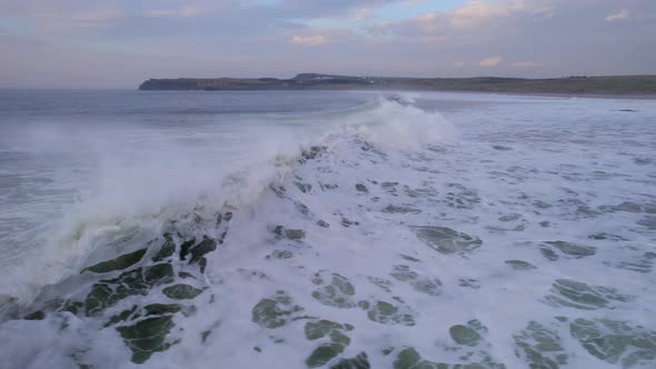 Ocean Waves Building Height to Crash into the Beach