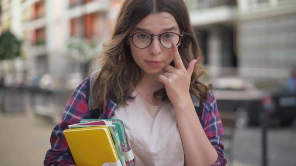 Cheerful Confident Teenage Girl Adjusting Eyeglasses Smiling Looking at Camera