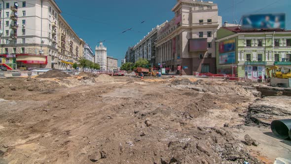 Excavator Working on Earthmoving at Open Pit Mining in the City Street Timelapse alt