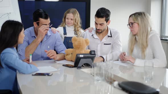 Smiling Pretty Caucasian Girl Discussing Startup with Multiracial Business People in Conference Room