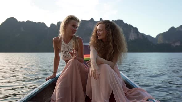 Girls Talking While Riding on Boat