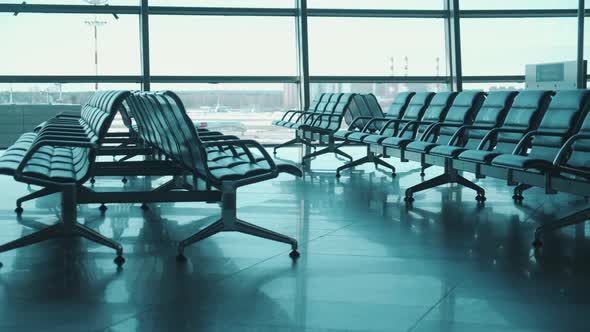 Rows of Airport Seats Marked with Crosses for Distancing