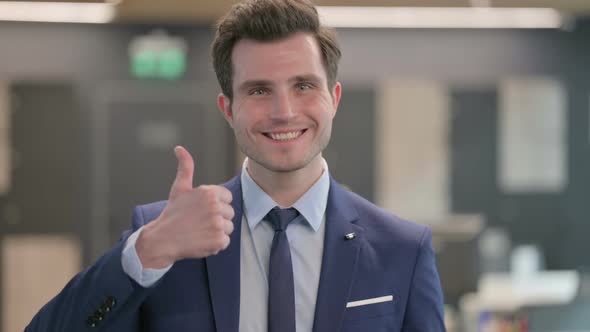 Portrait of Businessman Showing Thumbs Up Sign