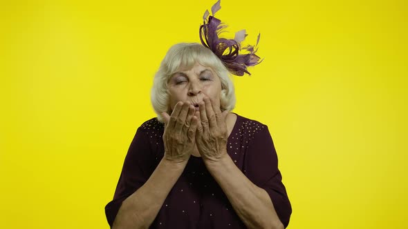 Happy Senior Old Woman Sending Air Fly Kisses To Camera, Demonstrating Love, Romantic Emotions