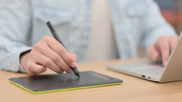 Male Hands Designing with Stylus on Tablet Close Up