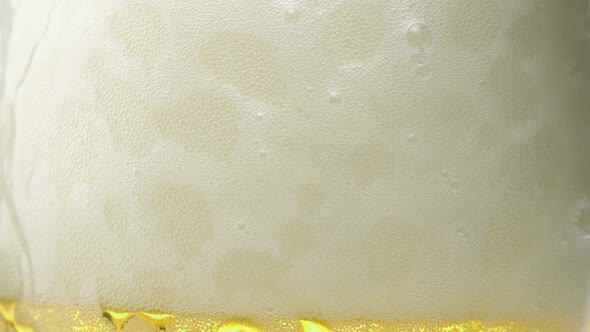 Extreme close-up beer foam and bubbles, Slow Motion