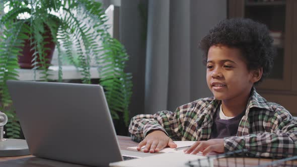 Afro Kid Studying Online At Home