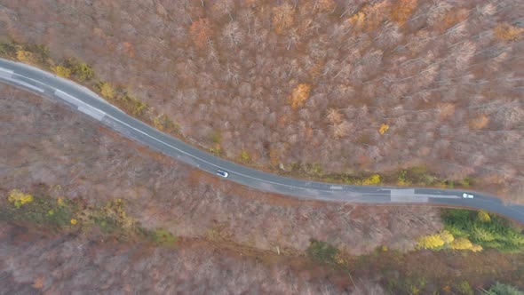 Car Passing Mountain Road, Drone Follows Slow Driving Car