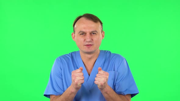 Medical Man Looking at the Camera with Excitement, Then Celebrating Victory. Green Screen