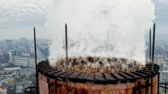 Aerial drone view of Chisinau. Tube of the thermal station with smoke