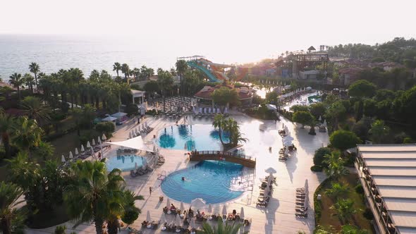 Top View of Tourists Enjoying Tropical Resort in Pools.