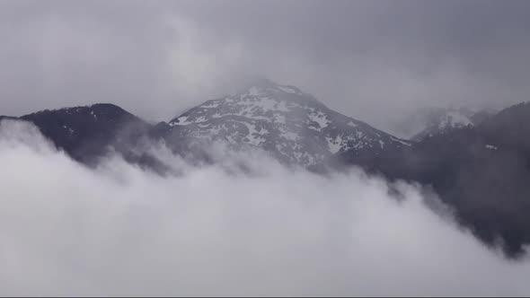 Top of Mountain in Snow and Clouds Landscape