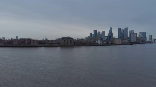 Rising drone shot of canary wharf Isle of dogs London in the evening