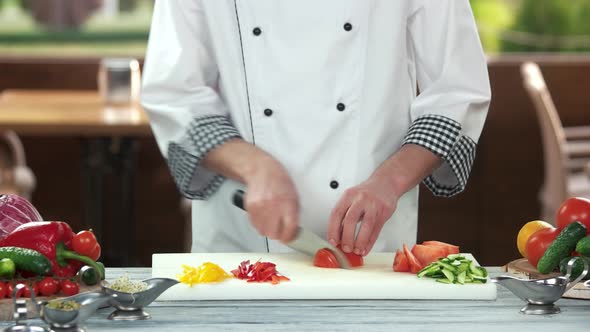 Chef Cutting a Tomato.