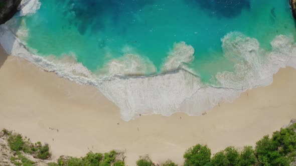 Drone Footage of White Sand Beach with Azure Water Foaming Ocean Waves